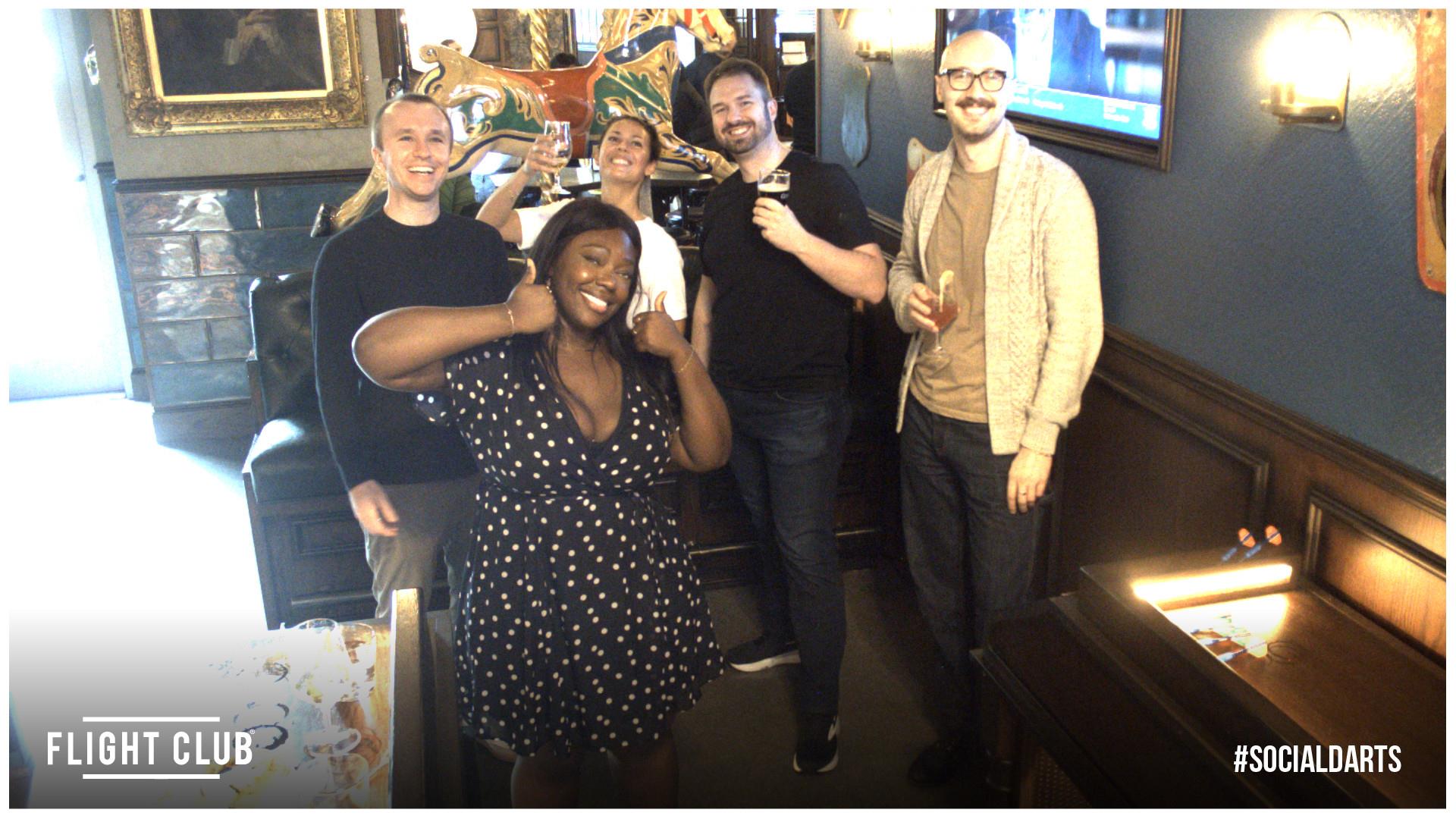 The group celebrating at Flight Club